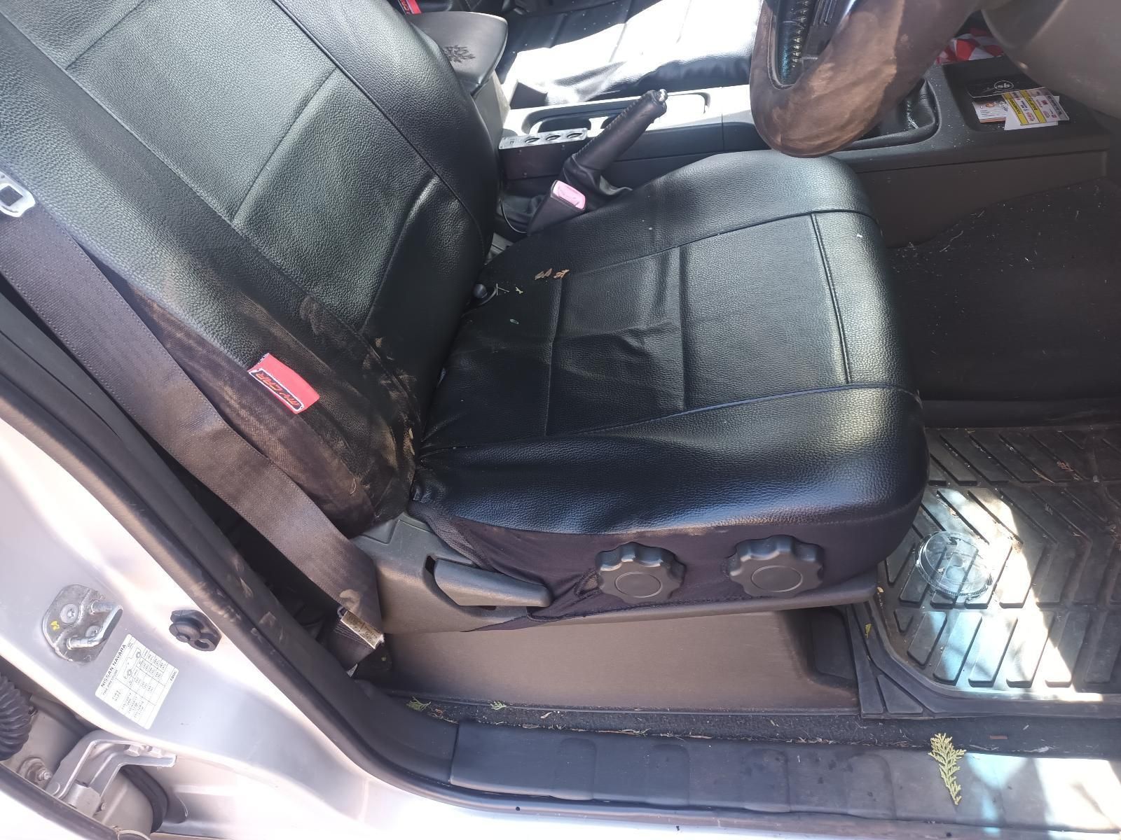 The Back Seat of a Silver Car with Black Seat Covers — South West 4WD Wreckers in Harristown, QLD