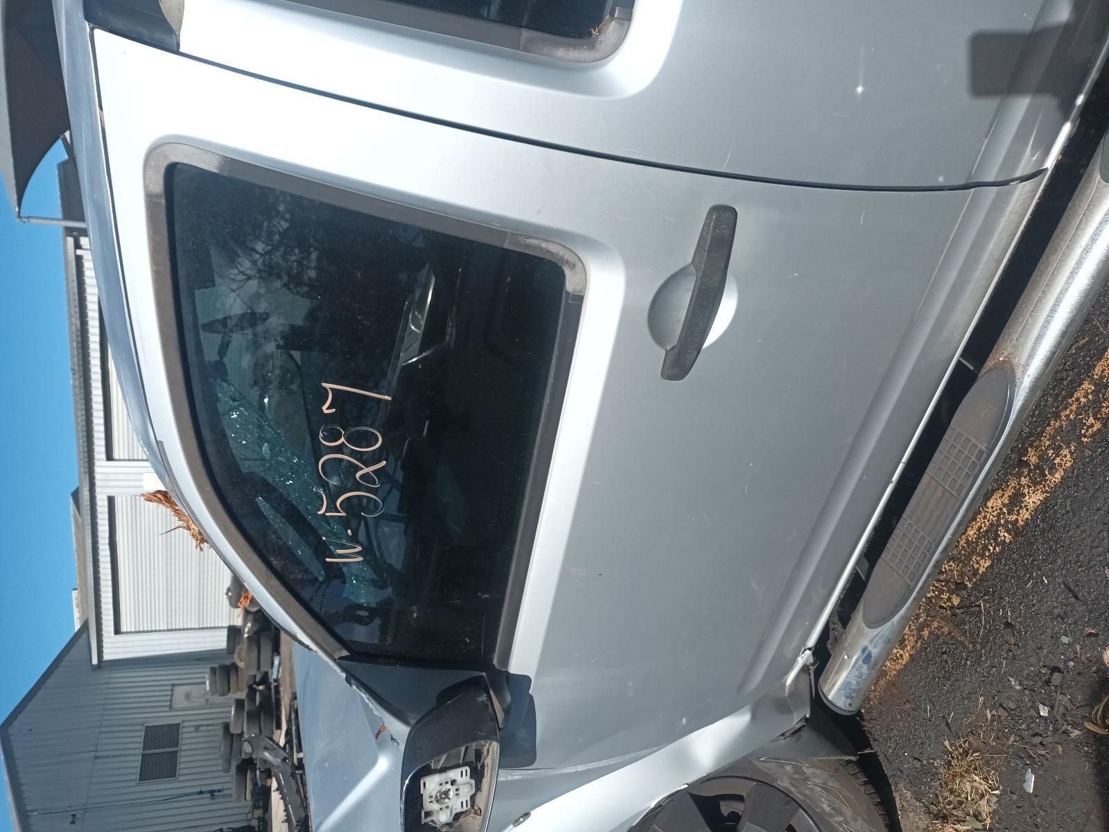 A Silver Truck is Parked on the Side of the Road — South West 4WD Wreckers in Harristown, QLD