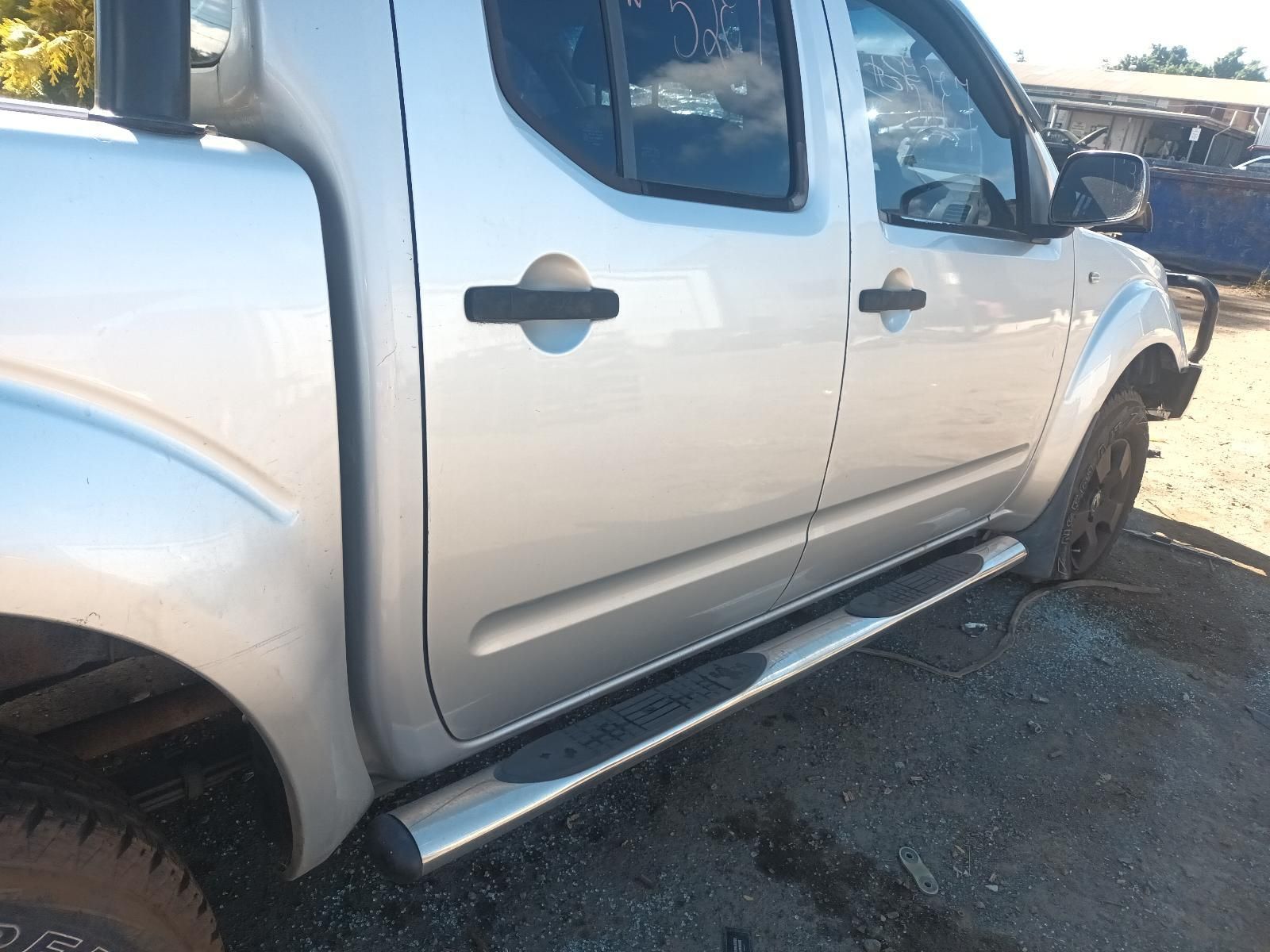 A Silver Pickup Truck is Parked on the Side of the Road — South West 4WD Wreckers in Harristown, QLD