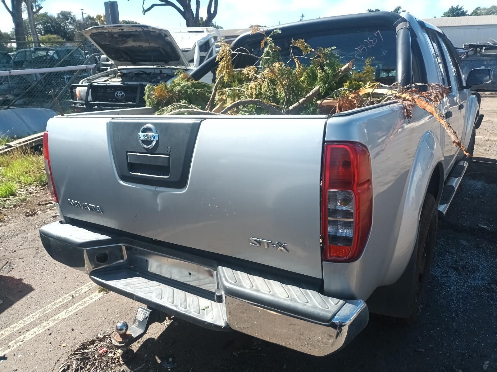 The Back of a Silver Nissan Pickup Truck with a Bunch of Plants in the Bed — South West 4WD Wreckers in Harristown, QLD