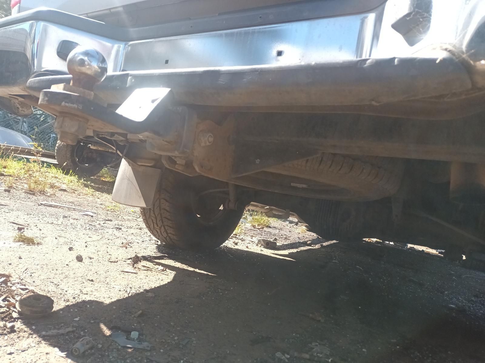 A Truck with a Trailer Attached to It is Parked on a Dirt Road — South West 4WD Wreckers in Harristown, QLD
