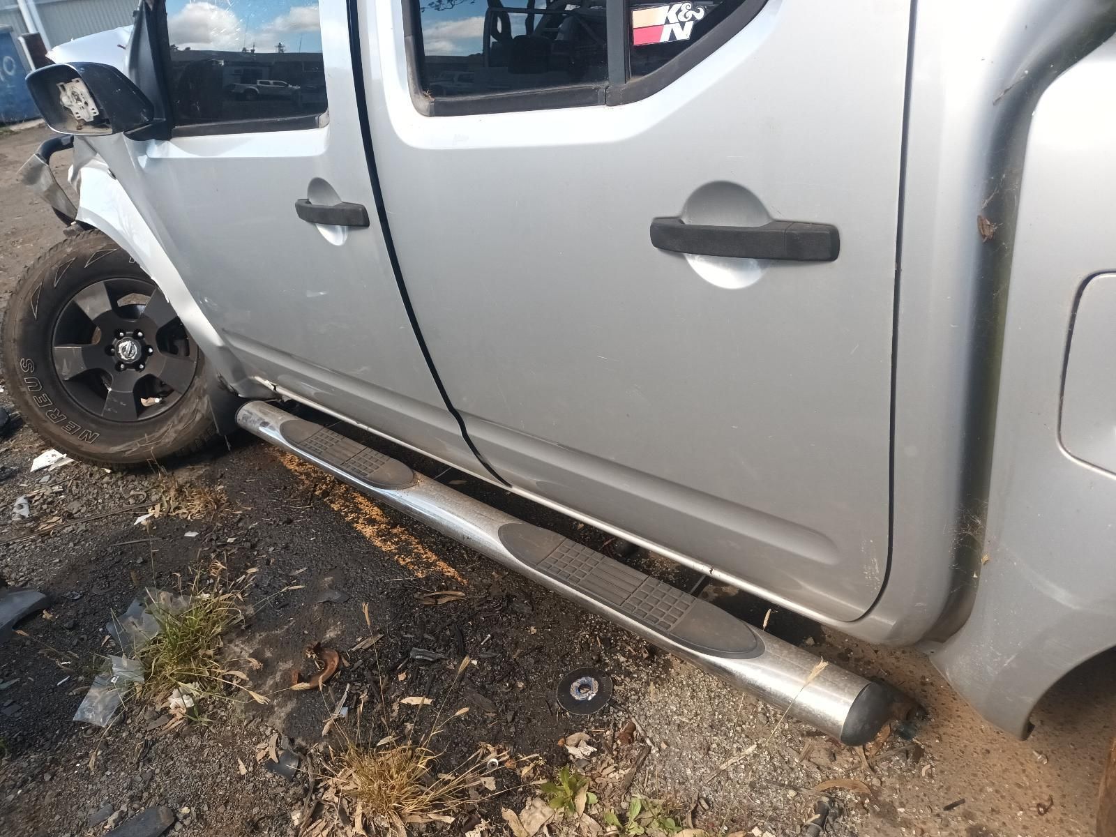 A Silver Truck is Parked on the Side of the Road — South West 4WD Wreckers in Harristown, QLD
