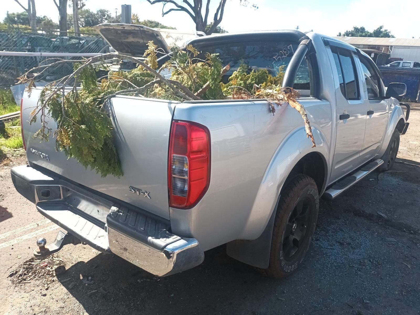 A Silver Truck with a Lot of Branches in the Bed — South West 4WD Wreckers in Harristown, QLD