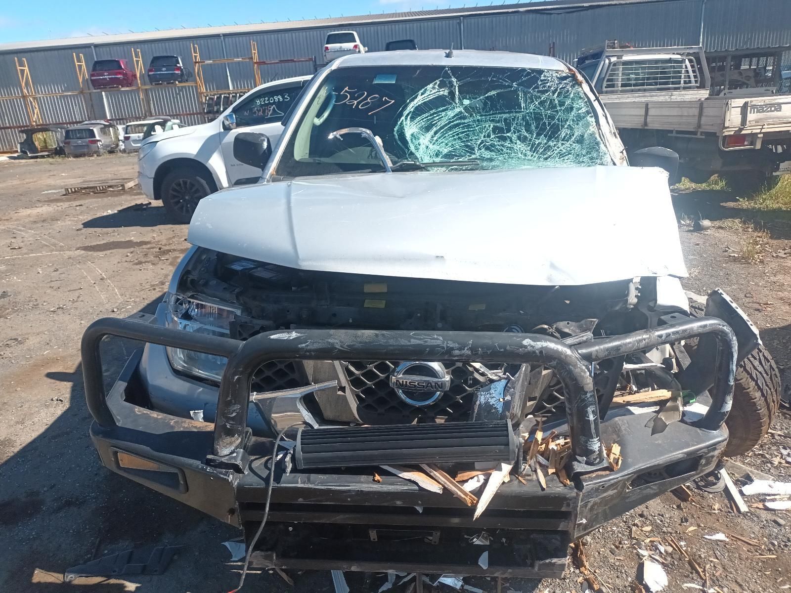 A White Car with a Broken Windshield is Parked in a Parking Lot — South West 4WD Wreckers in Harristown, QLD