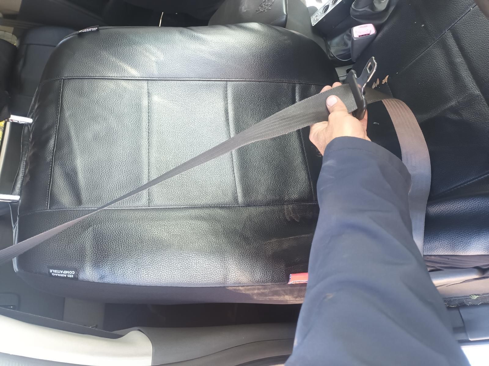 A Person is Holding a Seat Belt in a Car — South West 4WD Wreckers in Harristown, QLD