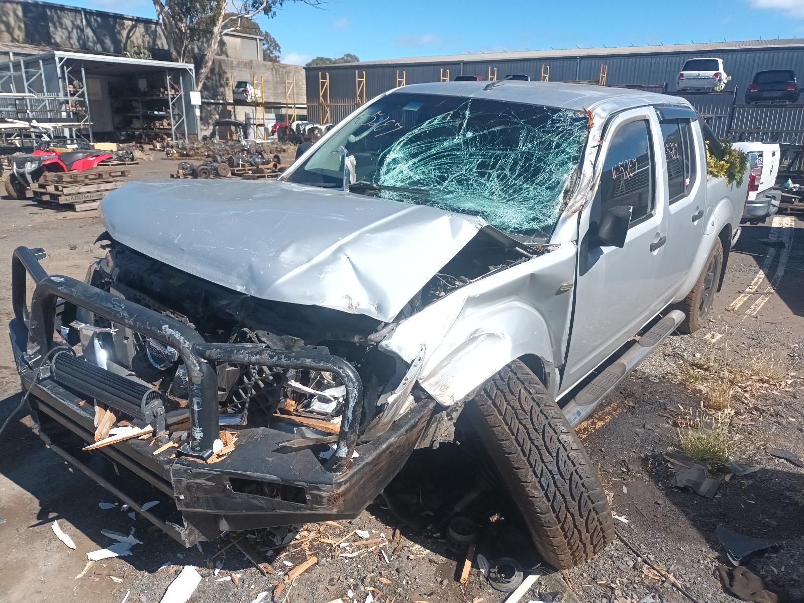 A Silver Truck with a Broken Windshield is Parked in a Scrap Yard — South West 4WD Wreckers in Harristown, QLD