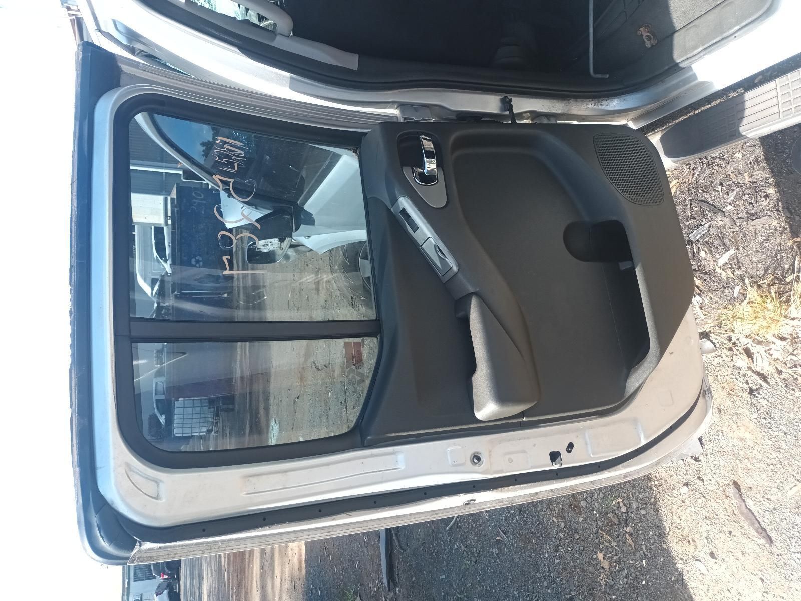 The Door of a Car is Open and Sitting on the Ground — South West 4WD Wreckers in Harristown, QLD