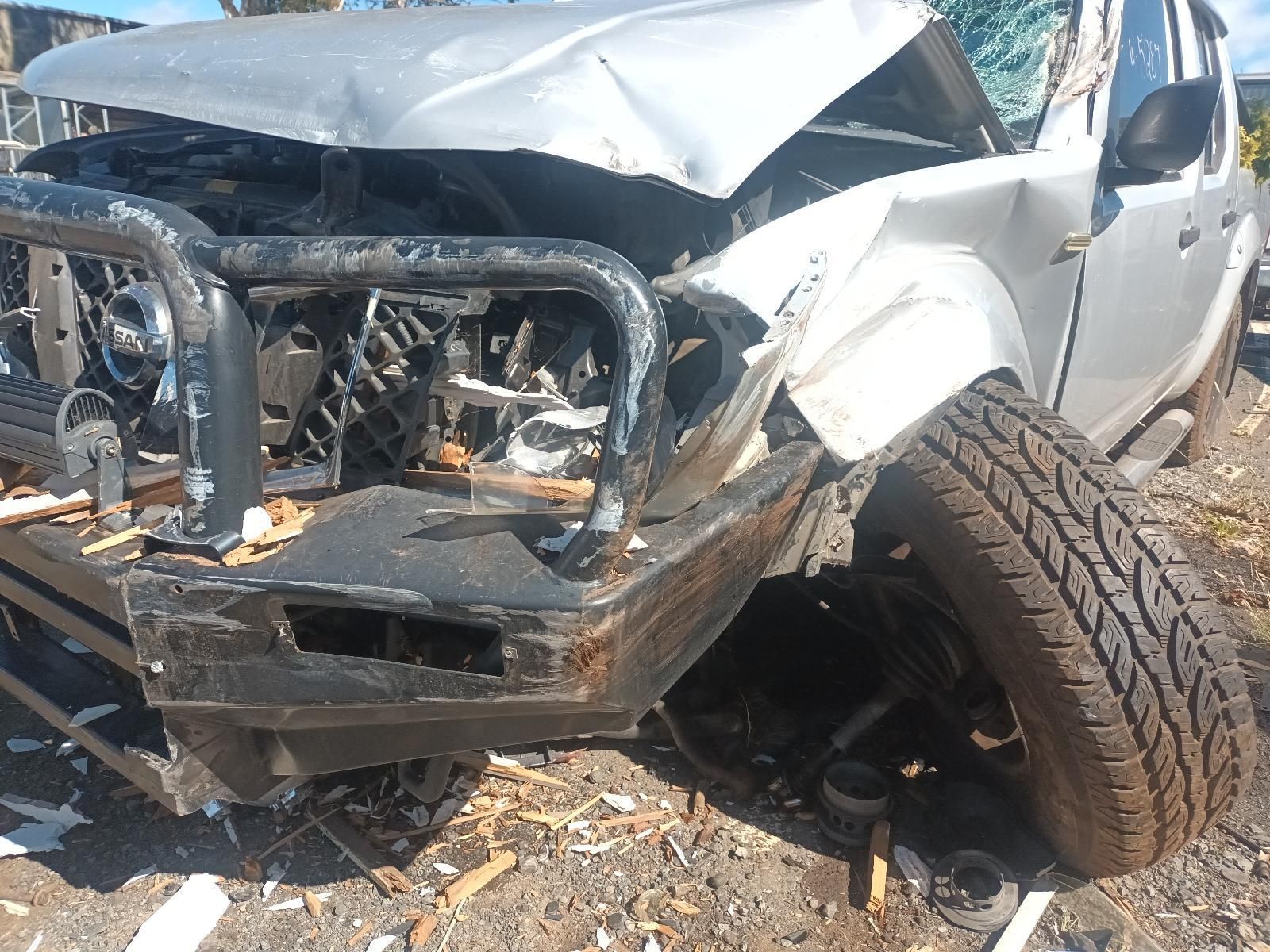 A White Truck with a Damaged Front End is Sitting on the Ground — South West 4WD Wreckers in Harristown, QLD