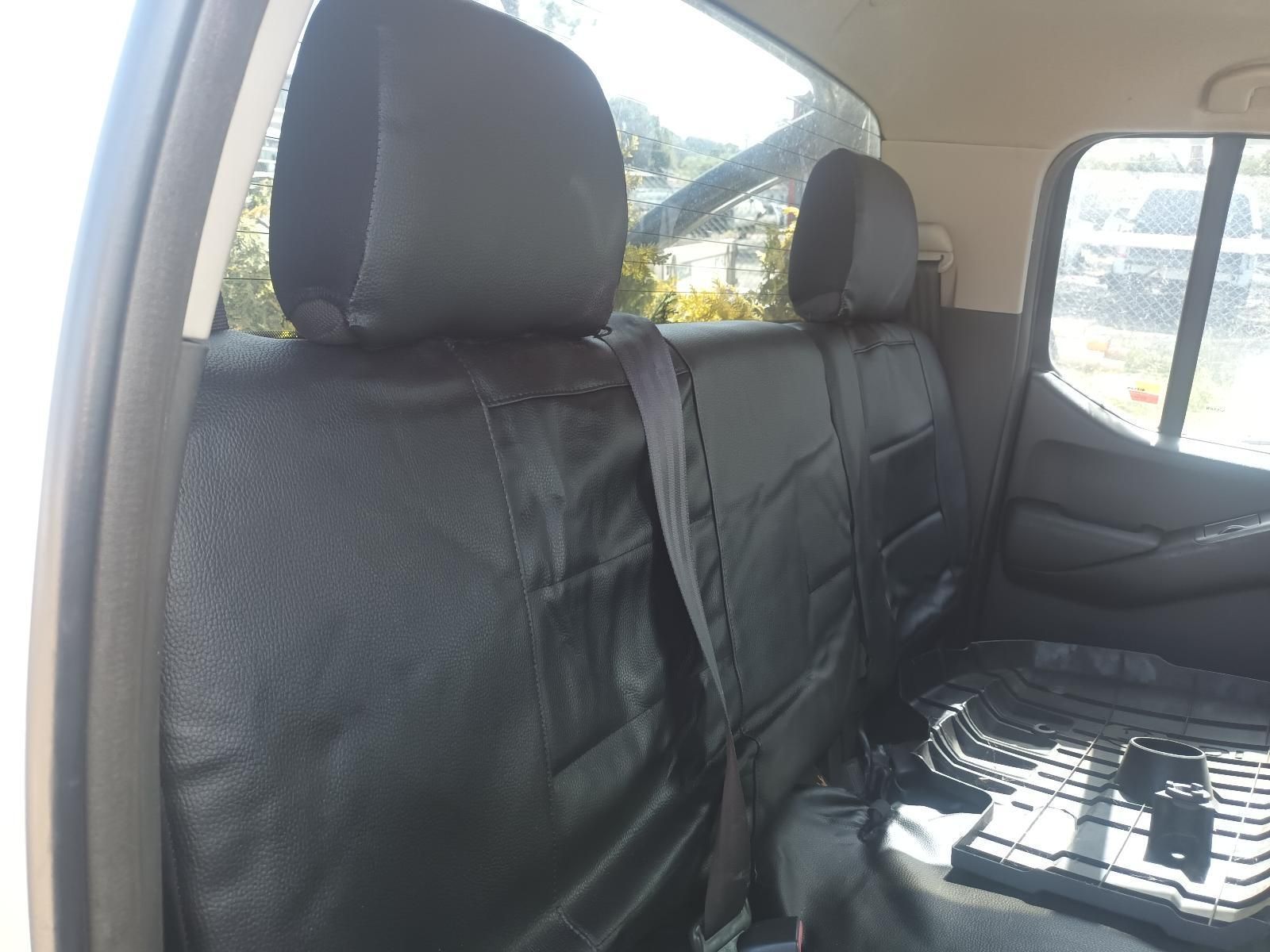 The Back Seat of a White Truck with Black Seat Covers — South West 4WD Wreckers in Harristown, QLD