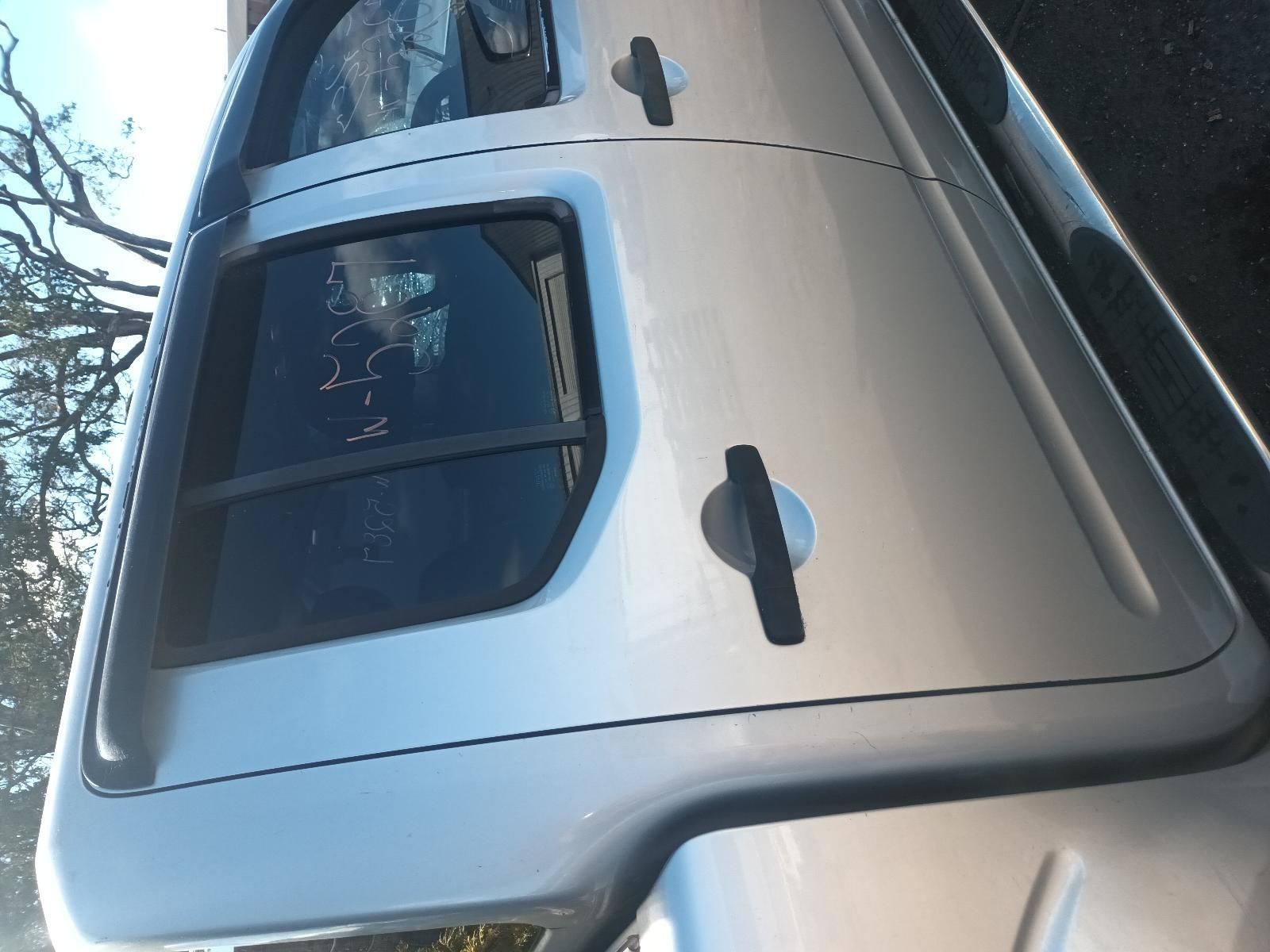 A Silver Truck is Parked on the Side of the Road — South West 4WD Wreckers in Harristown, QLD