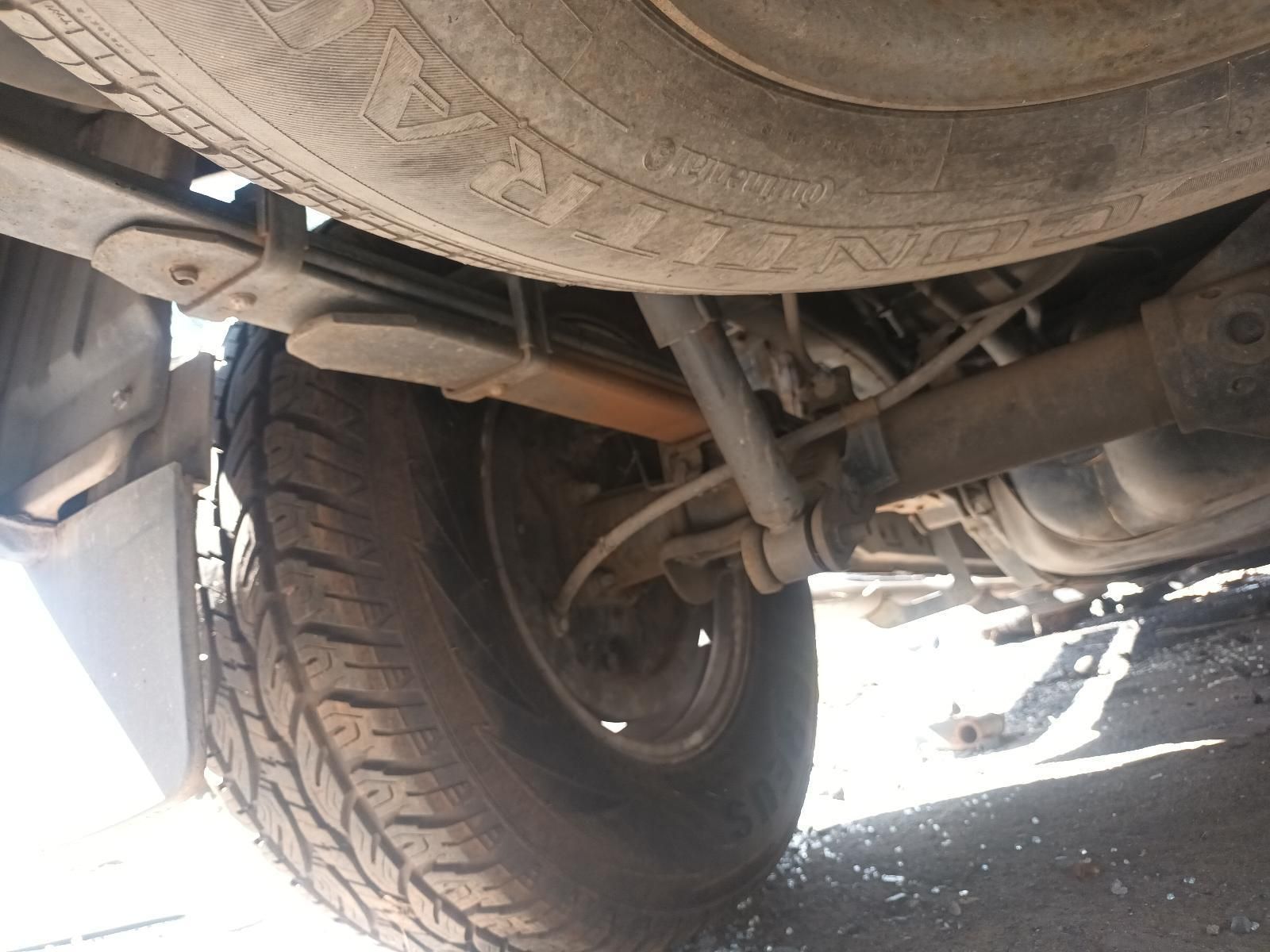 A Close Up of the Underside of a Car Showing the Tire and Suspension — South West 4WD Wreckers in Harristown, QLD