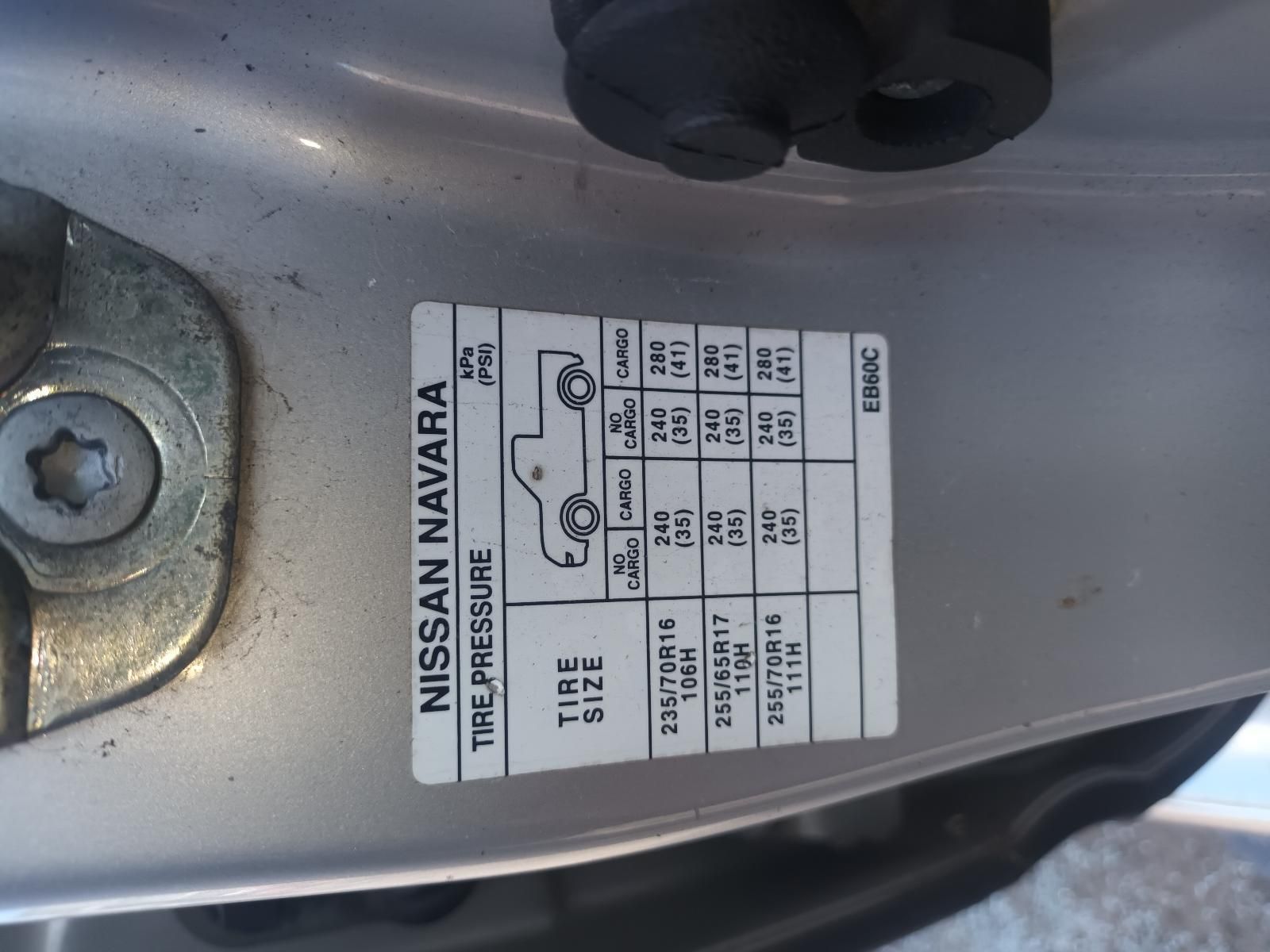 A Close Up of a Nissan Navara Tire Pressure Sticker — South West 4WD Wreckers in Harristown, QLD