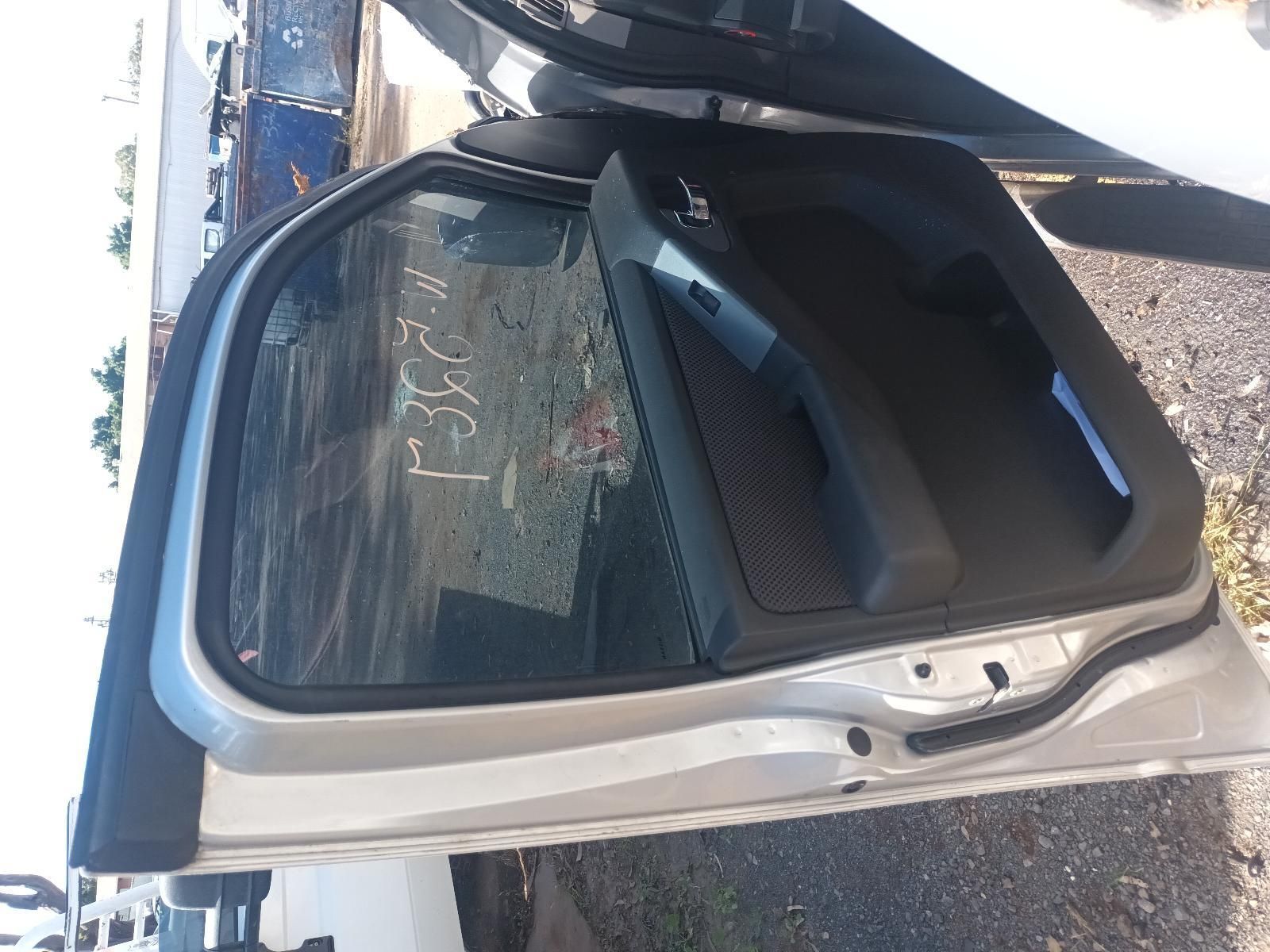 A Silver Car with the Door Open is Sitting on the Ground — South West 4WD Wreckers in Harristown, QLD