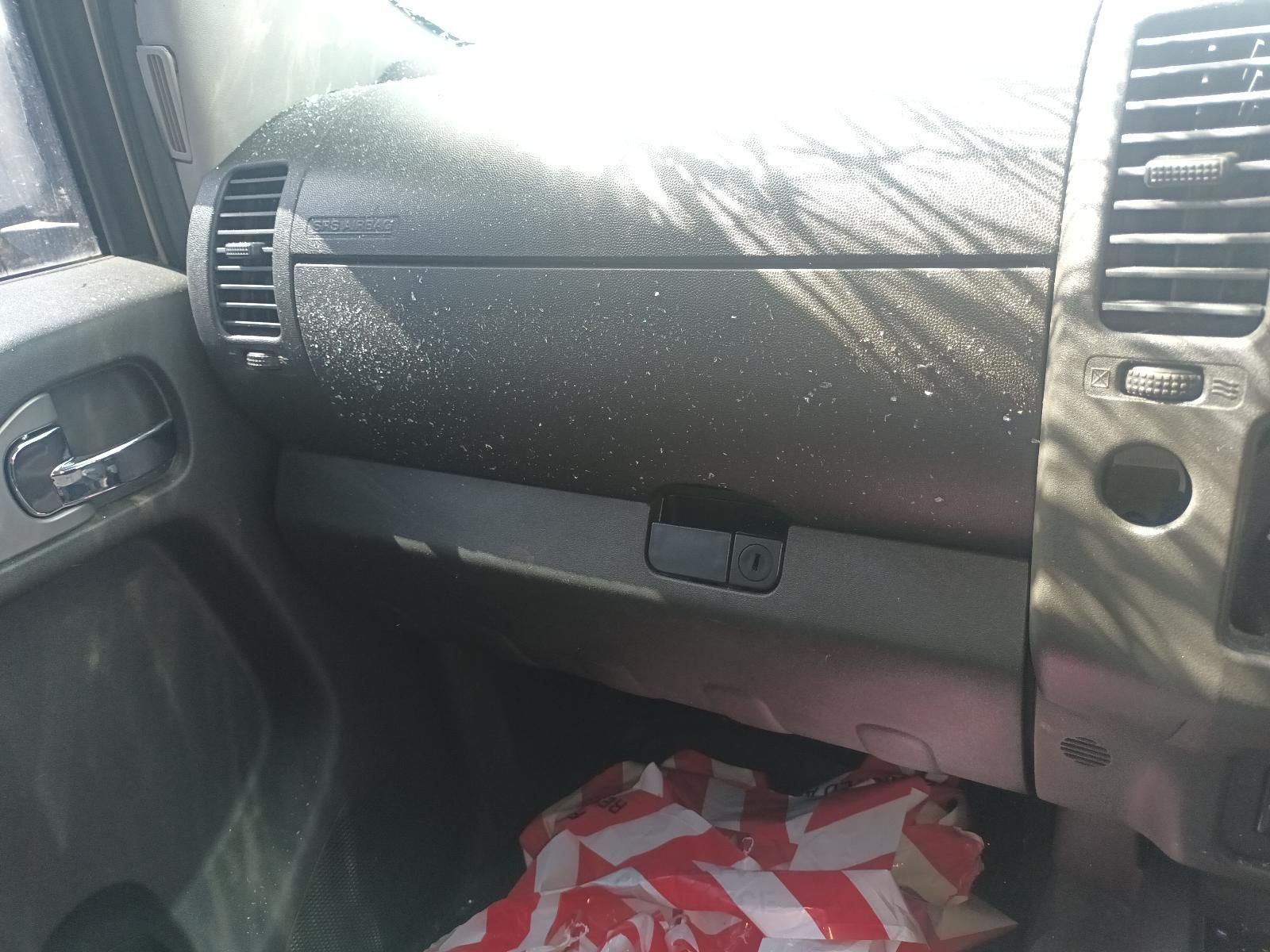 A Dirty Dashboard of a Car with a Bag on the Floor — South West 4WD Wreckers in Harristown, QLD