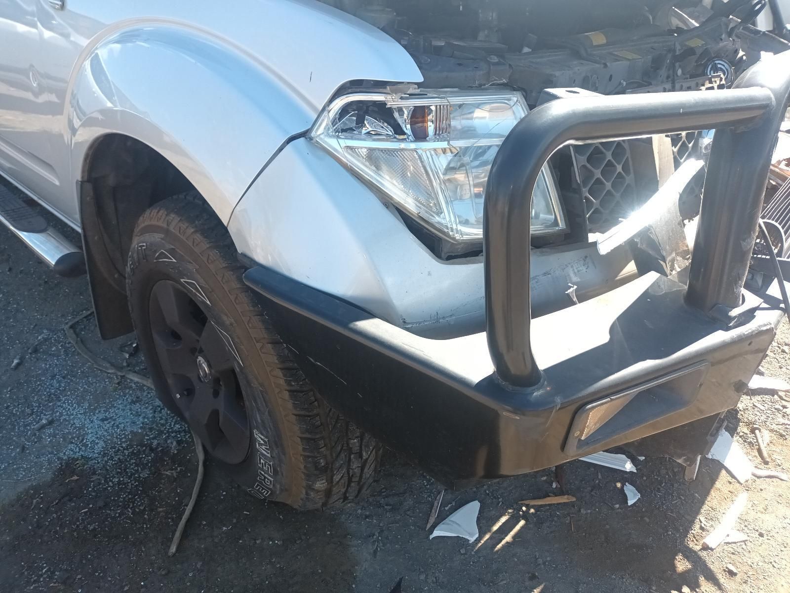A Silver Car with a Black Bumper is Parked on the Side of the Road — South West 4WD Wreckers in Harristown, QLD
