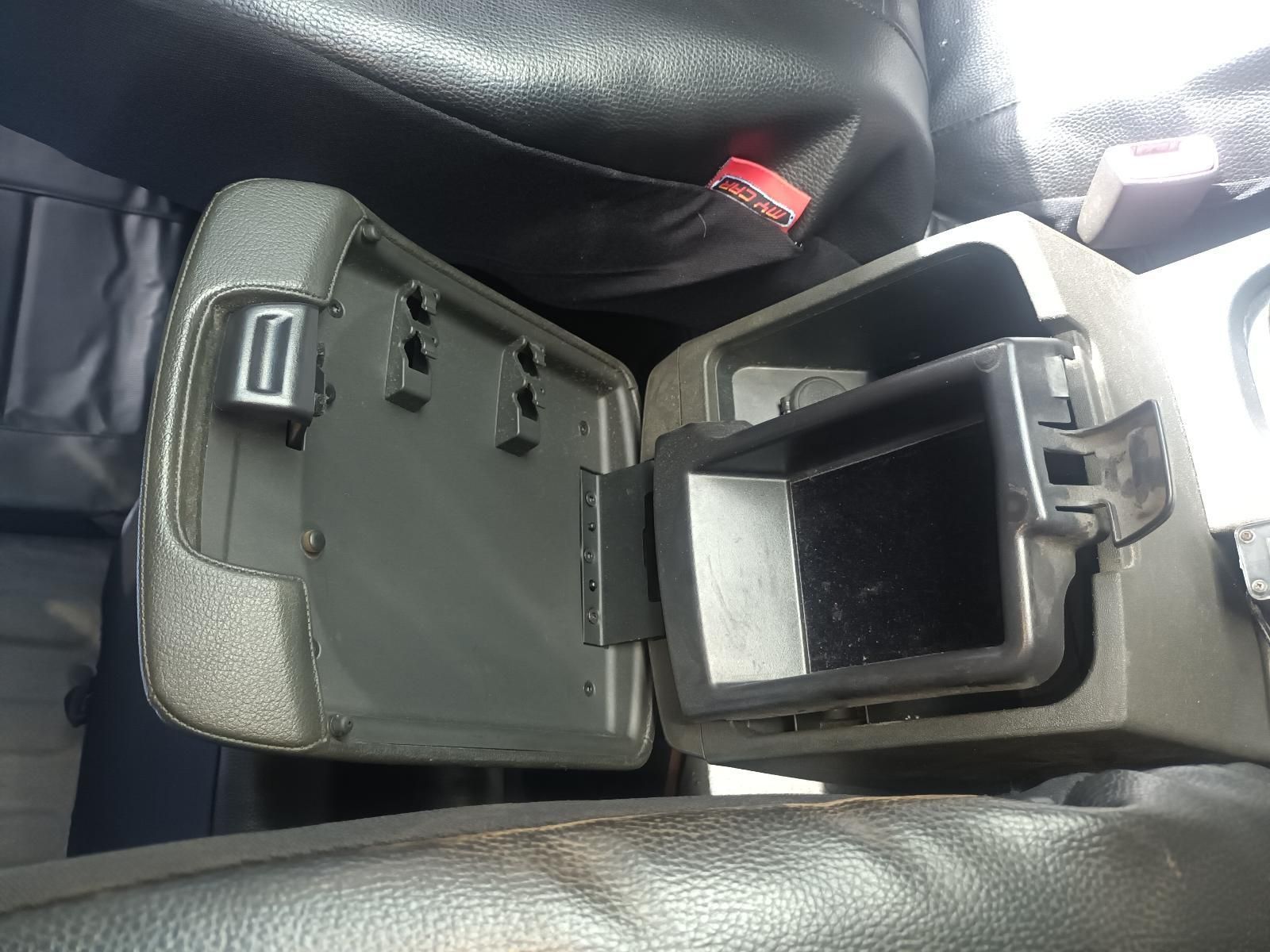 A Car Arm Rest with the Lid Open and a Small Container Inside of It — South West 4WD Wreckers in Harristown, QLD