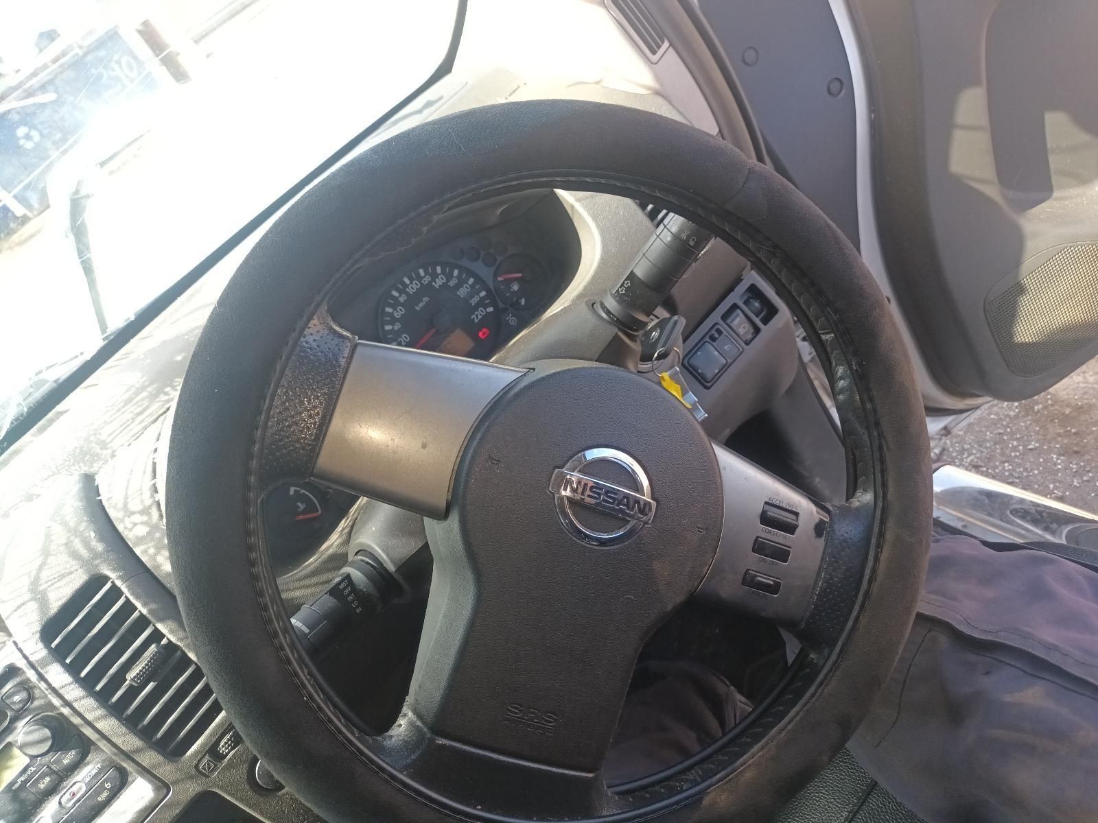 A Close Up of a Nissan Steering Wheel with a Black Steering Wheel Cover — South West 4WD Wreckers in Harristown, QLD