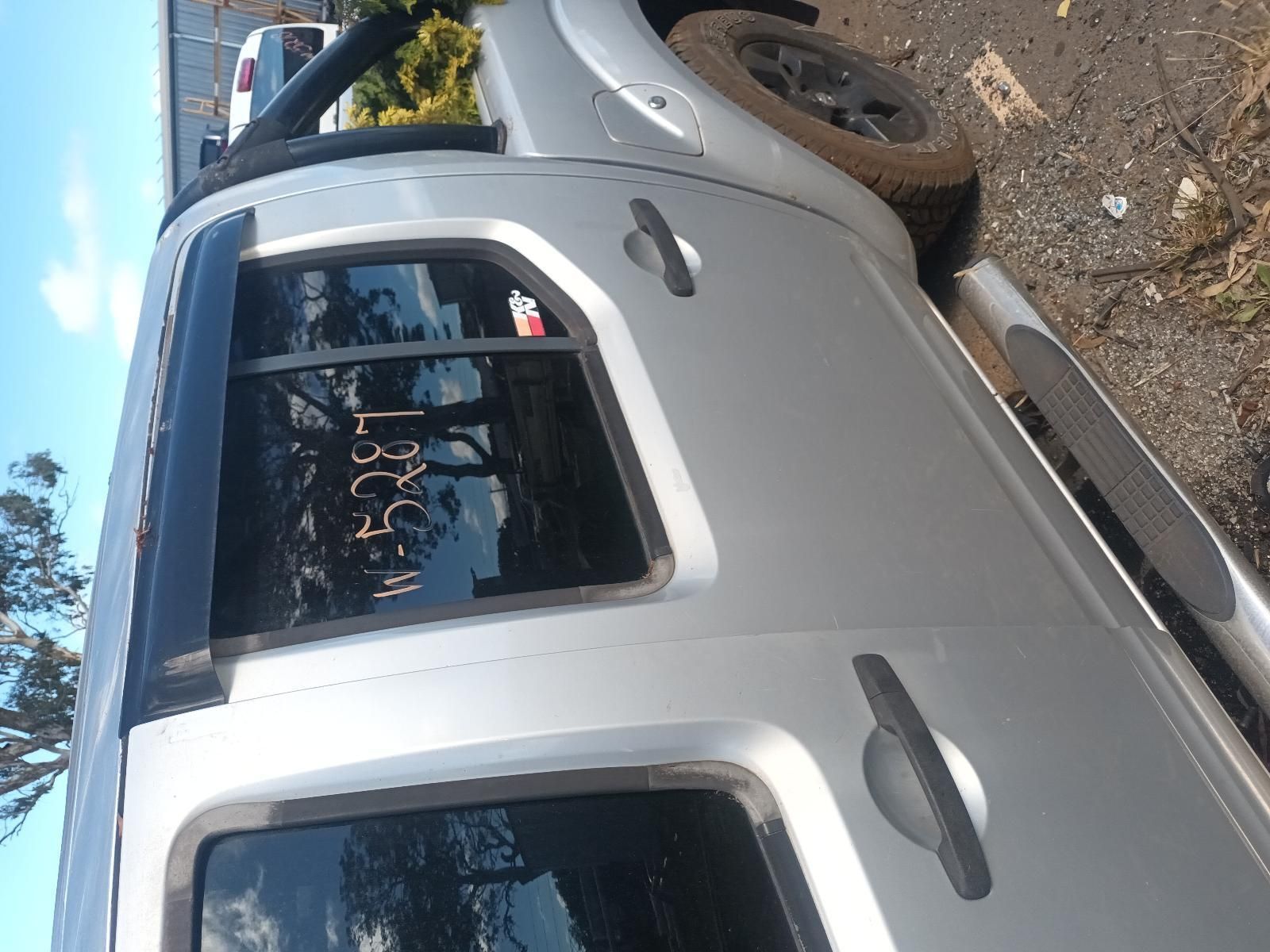A Silver Truck is Parked on the Side of the Road — South West 4WD Wreckers in Harristown, QLD