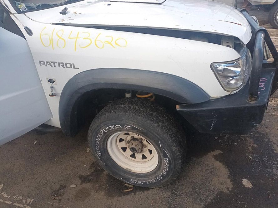 A White Patrol with the Hood Up is Sitting on the Ground — South West 4WD Wreckers in Harristown, QLD