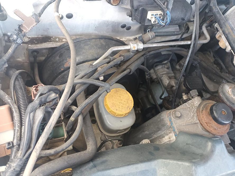 A Close Up of a Car Engine with a Yellow Cap on It — South West 4WD Wreckers in Harristown, QLD