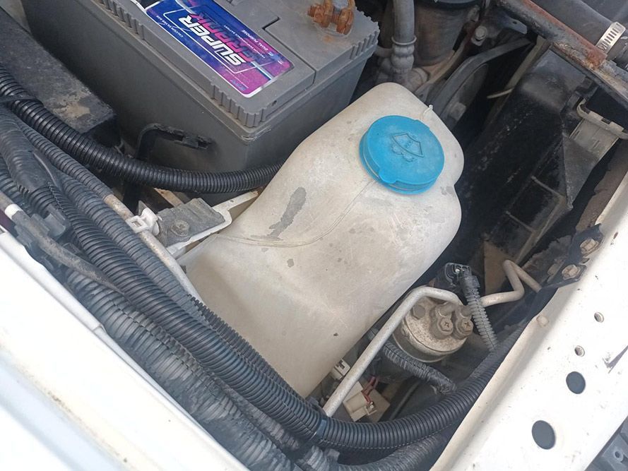 A Close Up of a Car Engine with a Blue Cap — South West 4WD Wreckers in Harristown, QLD