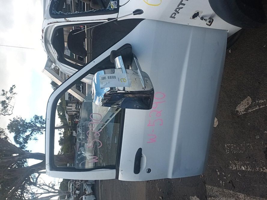 A White Truck with the Door Open is Parked on the Side of the Road — South West 4WD Wreckers in Harristown, QLD