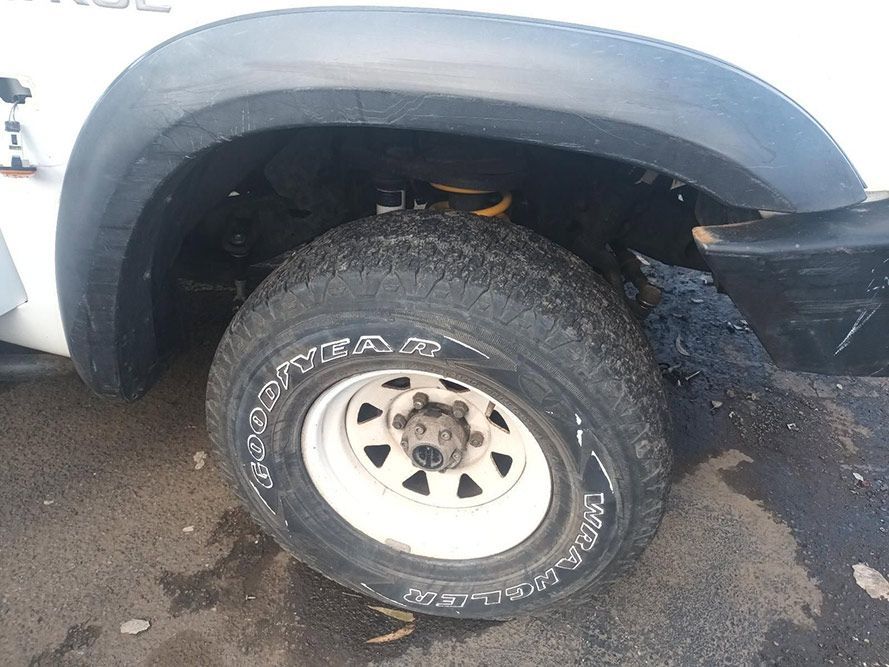 A Close Up of a Tire on a White Truck — South West 4WD Wreckers in Harristown, QLD