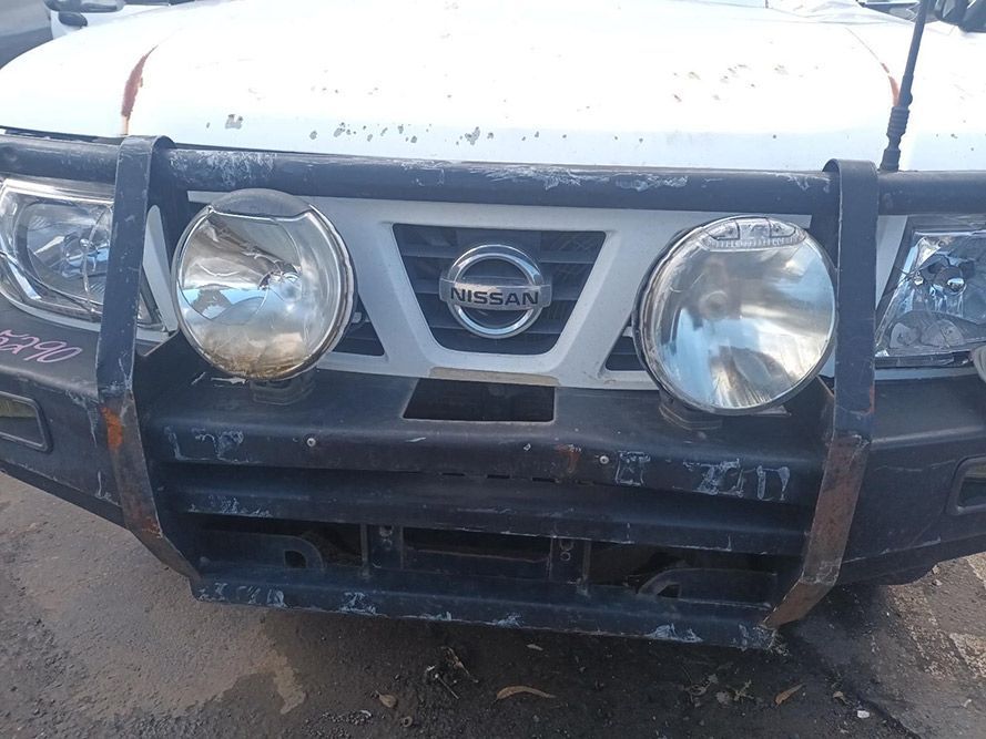 A White Nissan Truck with a Black Bumper and Headlights — South West 4WD Wreckers in Harristown, QLD