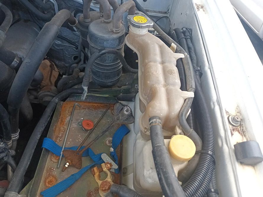 A Close Up of the Engine of a Car with a Battery — South West 4WD Wreckers in Harristown, QLD