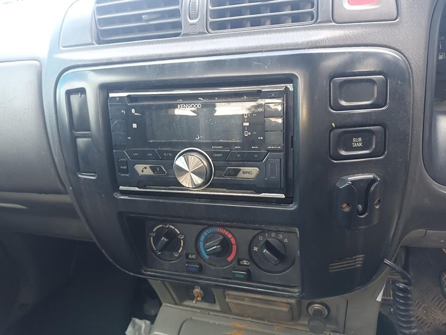 The Dashboard of a Car with a Radio and Climate Control — South West 4WD Wreckers in Harristown, QLD
