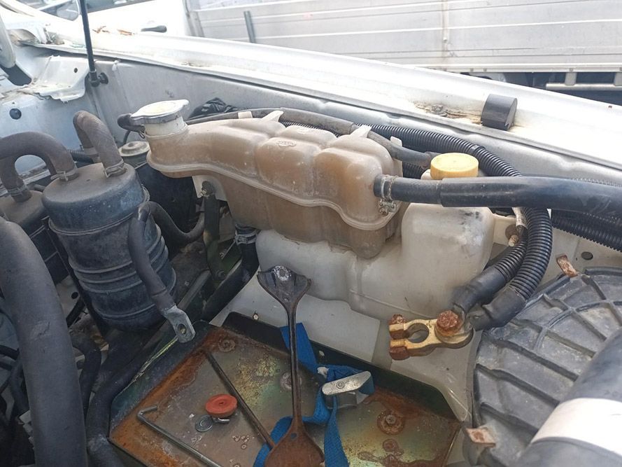 A Water Tank is Sitting Under the Hood of a Car — South West 4WD Wreckers in Harristown, QLD