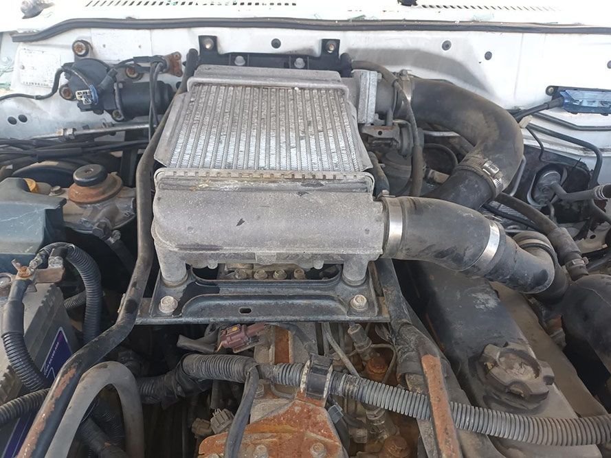 A Close Up of a Car Engine with a Radiator on Top of It — South West 4WD Wreckers in Harristown, QLD