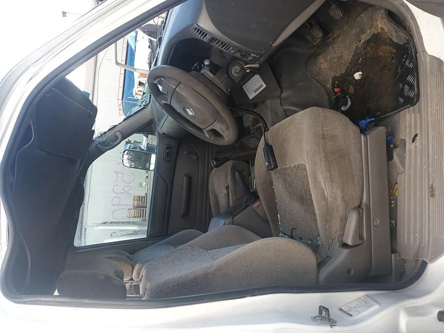 The Inside of a White Car with a Steering Wheel and Seats — South West 4WD Wreckers in Harristown, QLD