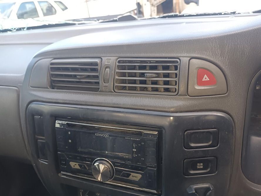 A Close Up of the Dashboard of a Car with a Red Triangle on It — South West 4WD Wreckers in Harristown, QLD