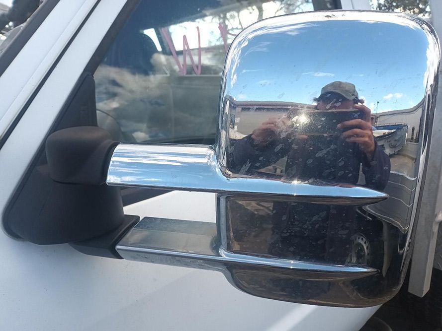 A Man is Taking a Picture of Himself in a Side View Mirror — South West 4WD Wreckers in Harristown, QLD