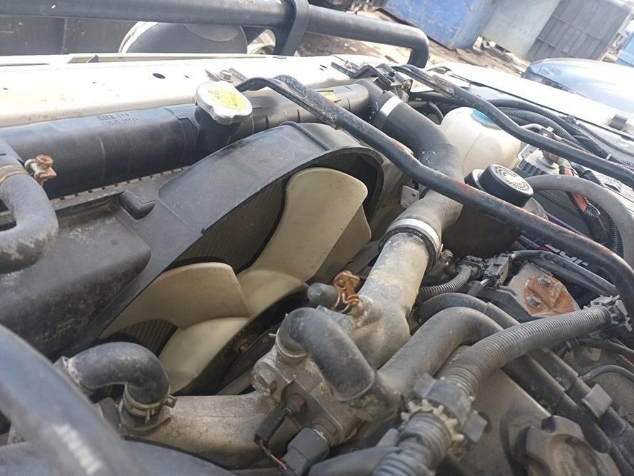 A Close Up of a Car Engine with a Fan in It — South West 4WD Wreckers in Harristown, QLD