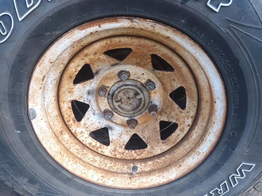 A Close Up of a Tire with a Rusty Rim — South West 4WD Wreckers in Harristown, QLD