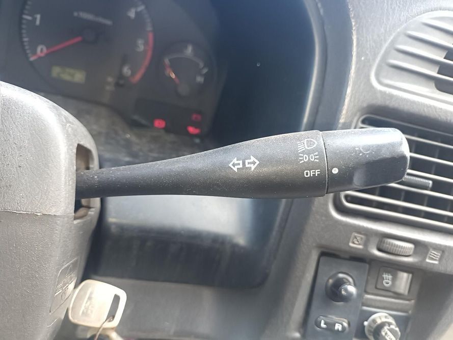 A Close Up of a Car Steering Wheel with a Wiper Switch on It — South West 4WD Wreckers in Harristown, QLD