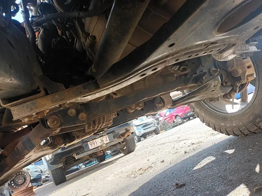 A Close Up of the Underside of a Car Parked in a Parking Lot — South West 4WD Wreckers In Brisbane, QLD