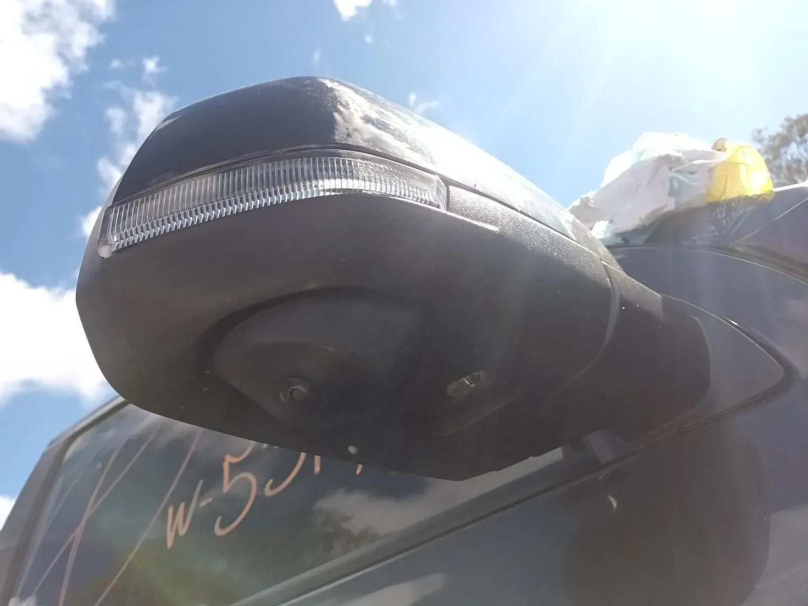 Black Side Mirror With a Turn Signal Light on a Dark Vehicle — South West 4WD Wreckers In Brisbane, QLD