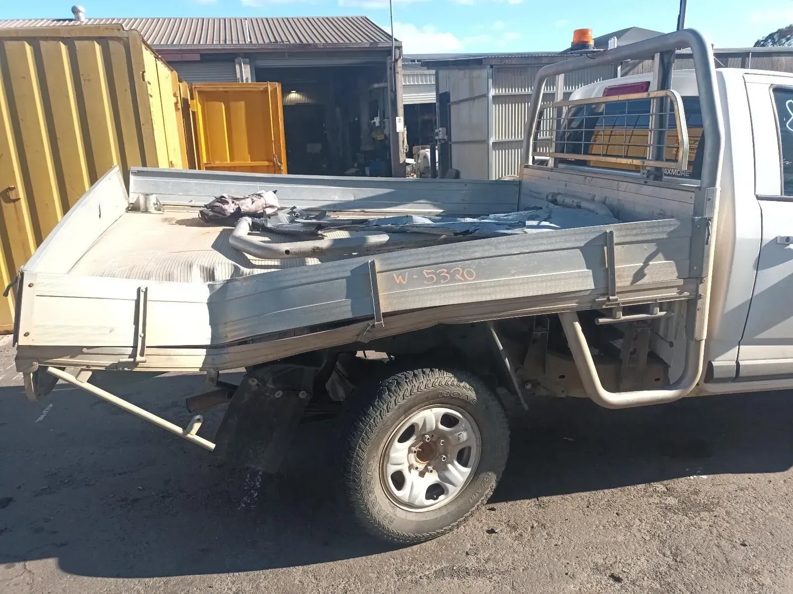 White Truck With a Flatbed in an Industrial Setting — South West 4WD Wreckers In Brisbane, QLD