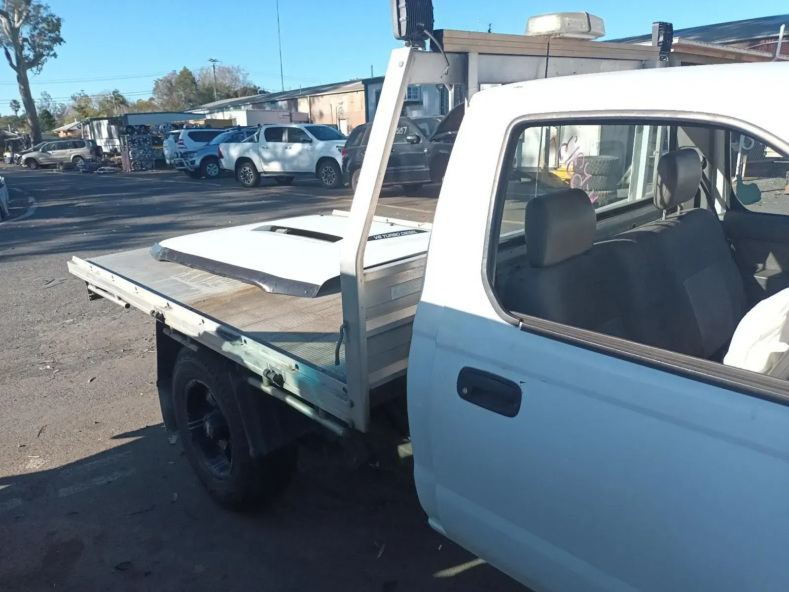 White Pickup Truck With a Flatbed in an Outdoor Setting — South West 4WD Wreckers In Brisbane, QLD