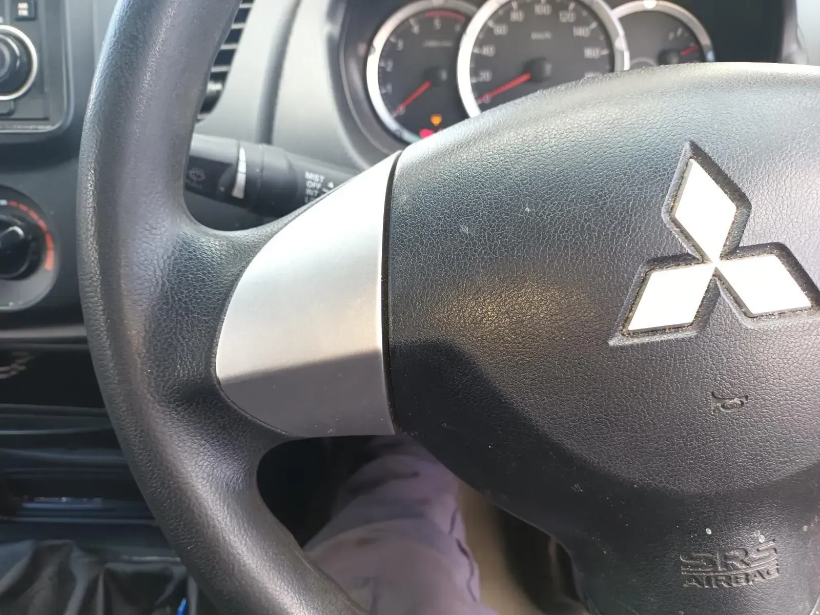 Black Steering Wheel With Mitsubishi Logo and Dashboard — South West 4WD Wreckers In Brisbane, QLD