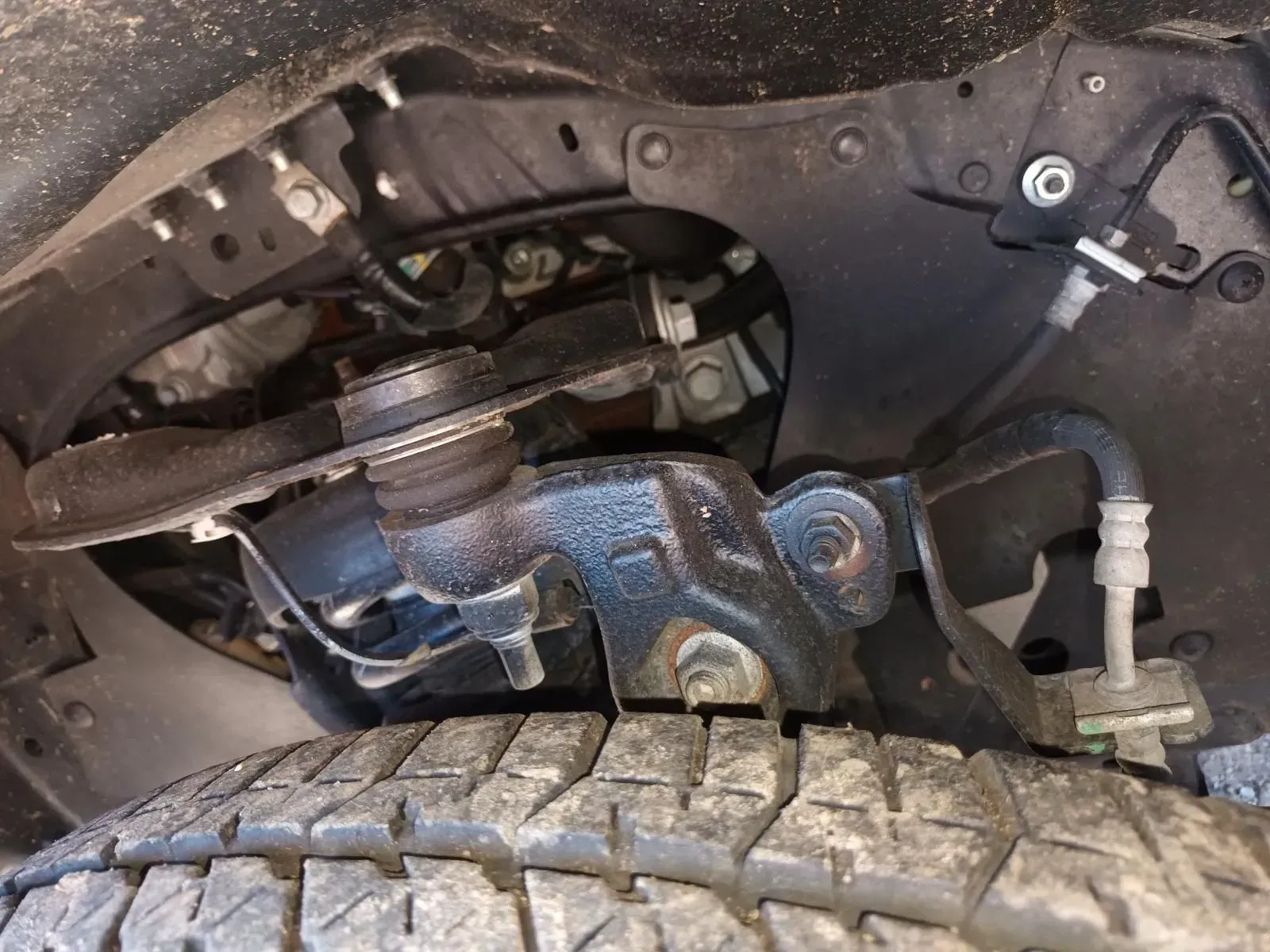 Black Vehicle Suspension System With Tyre Visible — South West 4WD Wreckers In Brisbane, QLD