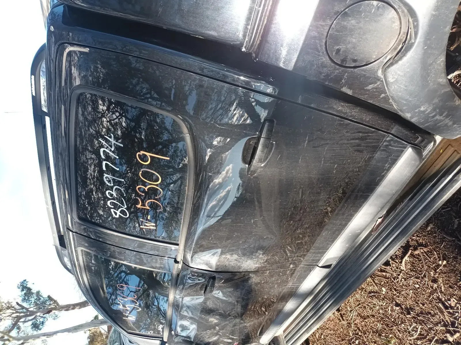 Black Car Door With Salvage Yard Markings — South West 4WD Wreckers In Brisbane, QLD