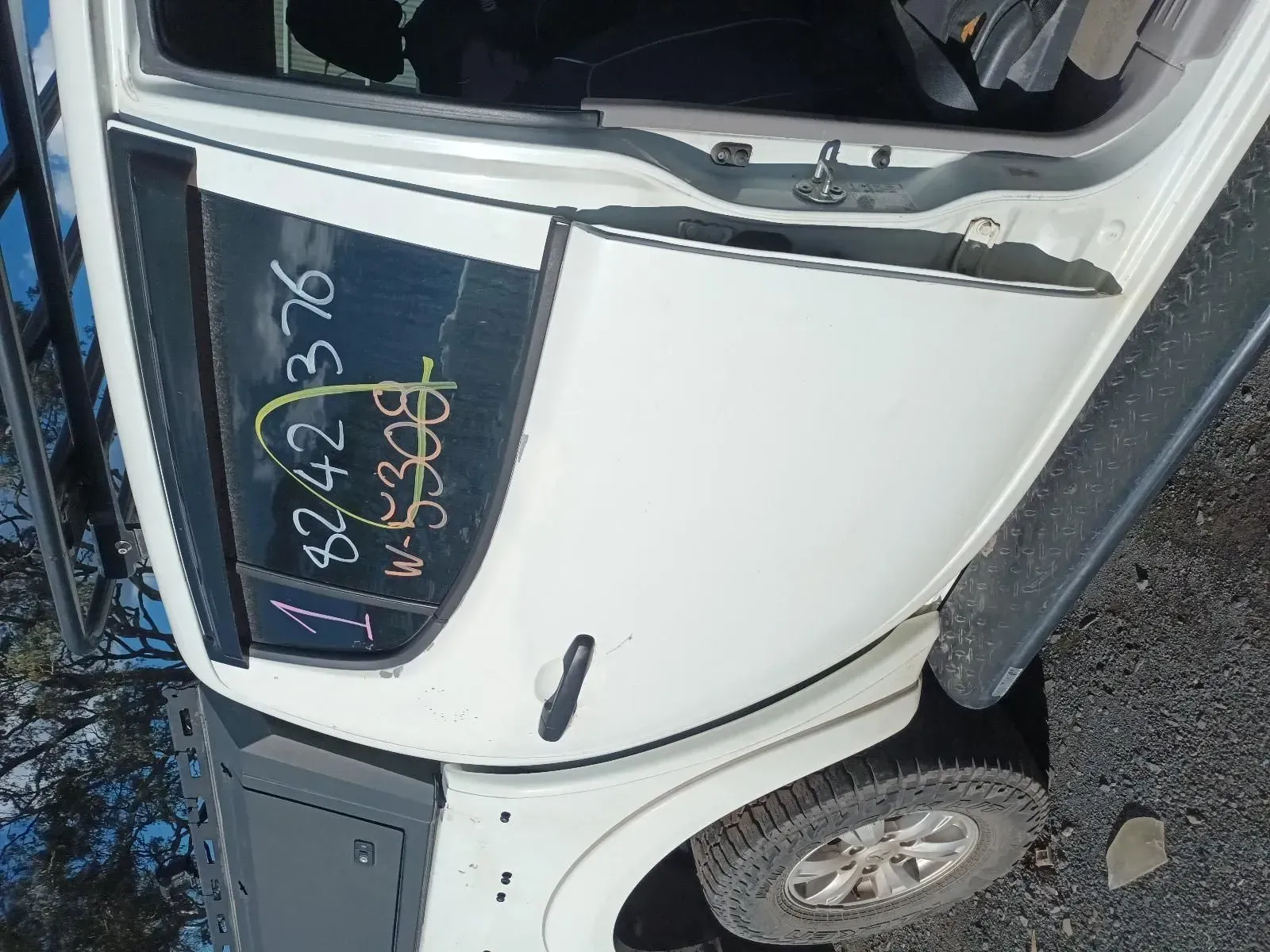 White Car Door With Handwritten Numbers on the Window — South West 4WD Wreckers In Brisbane, QLD
