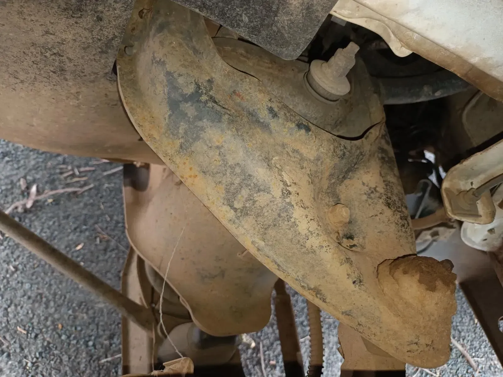 Close-up of a Rusty Vehicle Suspension Arm With a Visible Crack — South West 4WD Wreckers In Brisbane, QLD