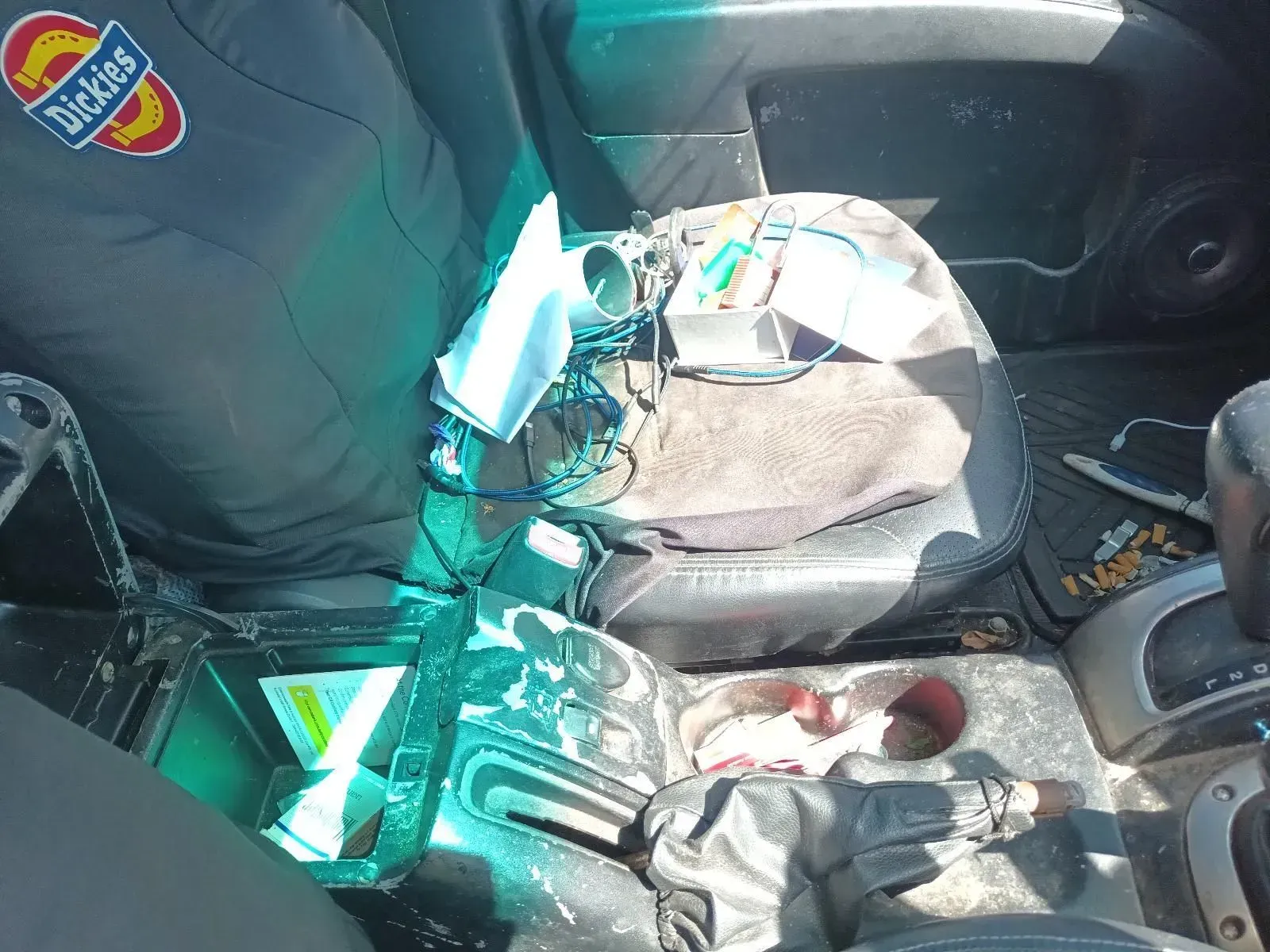 Interior of a Car, With a Grey Dickies Work Shirt Visible on the Left — South West 4WD Wreckers In Brisbane, QLD