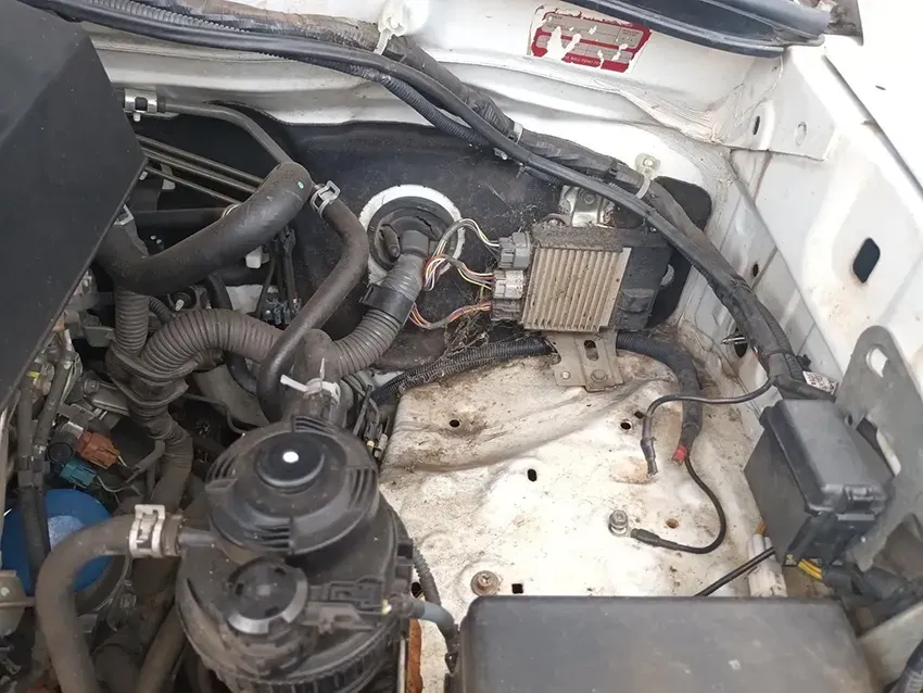 The Engine of a White Car is Shown With the Hood Open — South West 4WD Wreckers In Brisbane, QLD