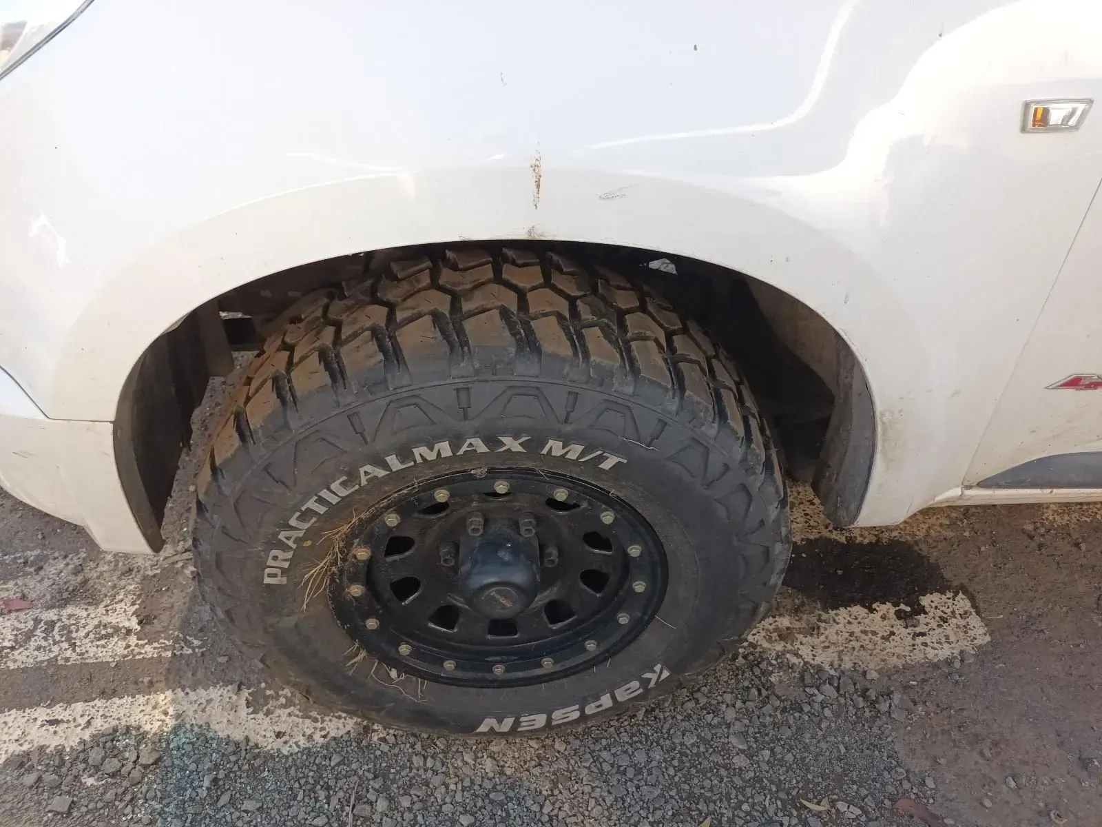 White Car Wheel With Black Mud Terrain Tyre — South West 4WD Wreckers In Brisbane, QLD